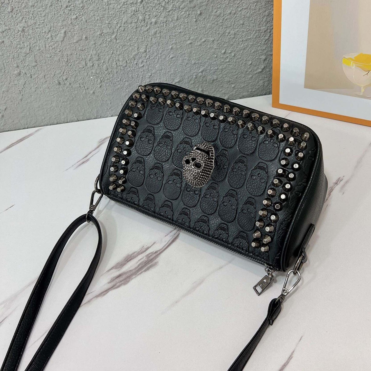 Embossed Skull Riveted Shoulder Bag