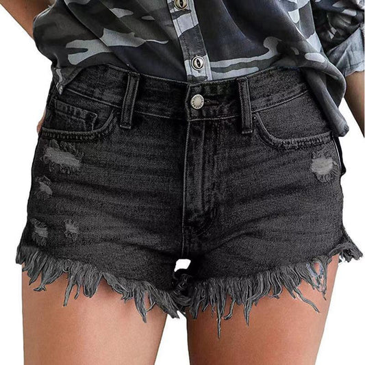 Short en denim de couleur unie à pompons déchirés