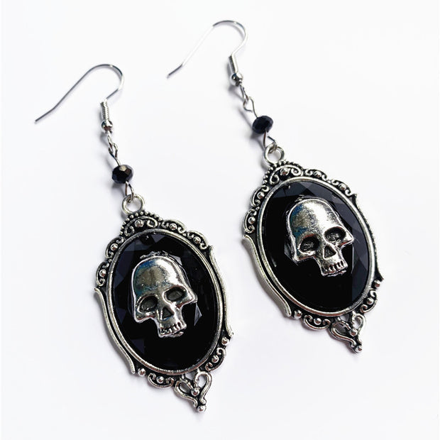 Boucles d'oreilles pendantes avec pierres précieuses et crâne vintage 