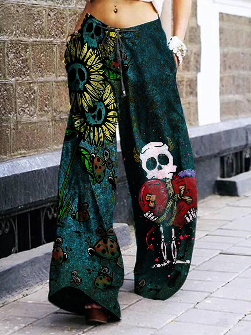 Pantalon large imprimé tête de mort et fleurs 