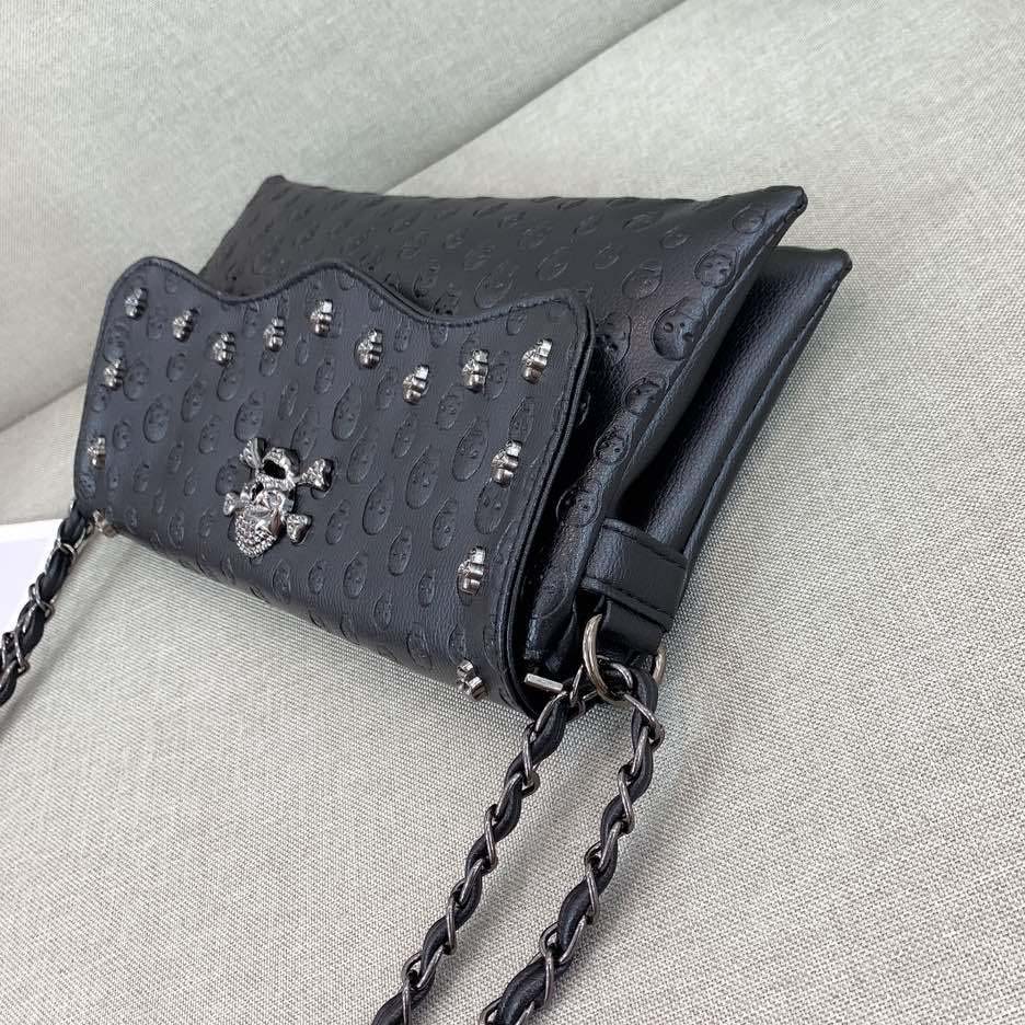 Embossed Riveted Skulls Shoulder Bag